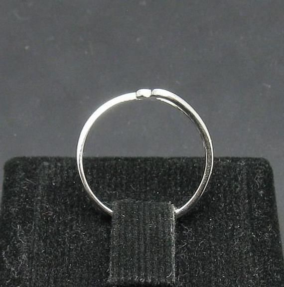 Sterling silver ring, - 925/1000. Stamped 925.Approximate weight 1.2 grams. Top width 0.9cm (0.36 inches). All our jewels are made from solid sterling silver 925/1000 and are carefully crafted by hand in our family workshop. We dispatch your orders in 5 working days, worldwide and the postage is $5. We ship registered priority mail. Please allow 5-7 working days for delivery in Europe and 10-15 working days outside Europe. For any questions - please do not hesitate to contact me! Nickel Free White Gold Open Ring, Elegant Nickel Free Round Band Ring, Elegant Nickel-free Round Band Ring, Nickel-free Open Band White Gold Jewelry, Nickel-free White Gold Toe Ring, Simple Sterling Silver Diamond Ring For Anniversary, Nickel Free White Gold Open Band Jewelry, Nickel-free White Gold Open Band Jewelry, Silver Diamond Ring With Simple Design As Gift