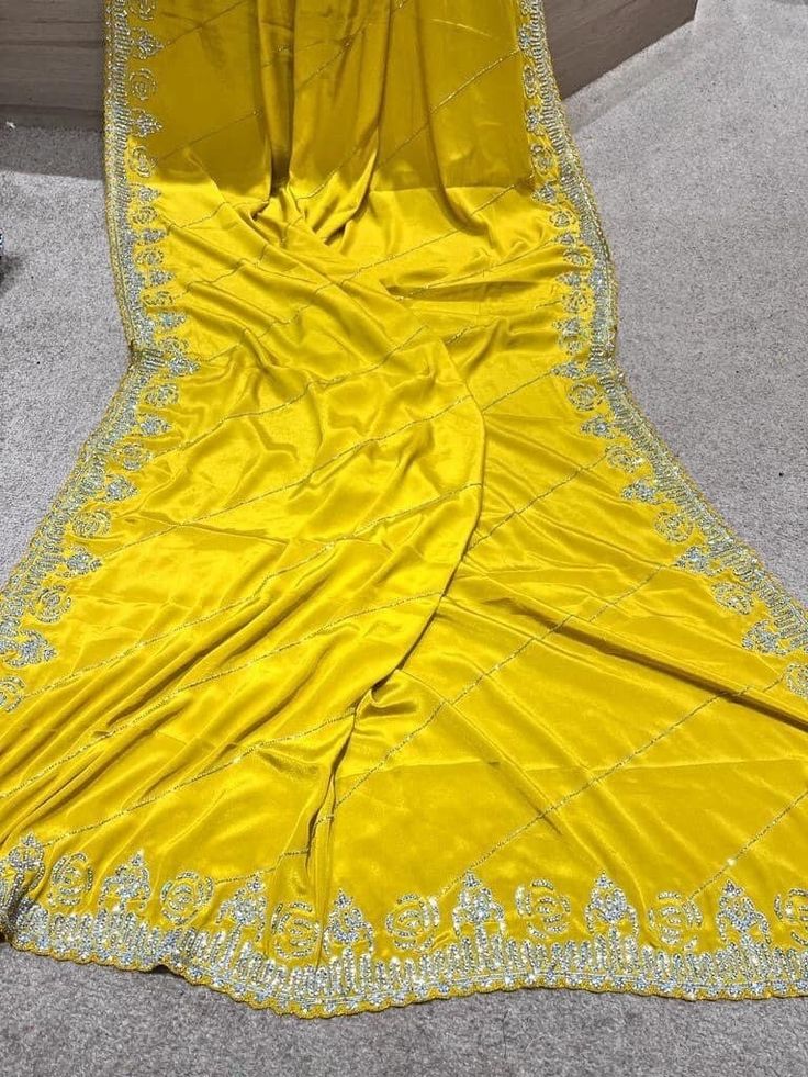 zarkan heavy hand crafted pure crepe silk saree in yellow. It is an exclusive heavy wedding party wear saree. comes with pre stitched blouse Yellow Silk Sharara With Dabka Work, Yellow Silk Pre-draped Saree With Pallu, Yellow Dola Silk Pre-draped Saree For Navratri, Yellow Silk Traditional Wear With Dabka Work, Elegant Yellow Silk Sharara, Yellow Katan Silk Pre-draped Saree, Yellow Chinon Pre-draped Saree, Semi-stitched Yellow Blouse Piece In Traditional Drape, Semi-stitched Yellow Blouse Piece With Traditional Drape