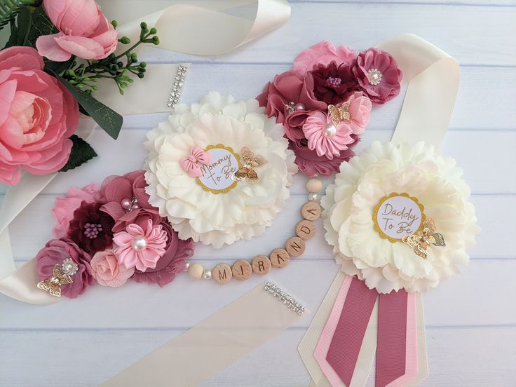 pink and white flowers with name tags on them