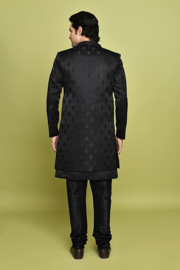 Black sherwani featuring leaf pattern. Paired with a solid sleeveless inner kurta. - Aza Fashions Formal Black Set With Pallu, Traditional Black Kurta For Groom, Traditional Drape Black Kurta For Groom, Black Sherwani With Pallu For Festivals, Black Traditional Wear With Resham Embroidery For Groom, Black Dabka Sherwani For Groom, Black Traditional Wear With Resham Embroidery For Wedding, Black Sherwani For Groom On Eid, Black Long Sleeve Traditional Wear For Groom