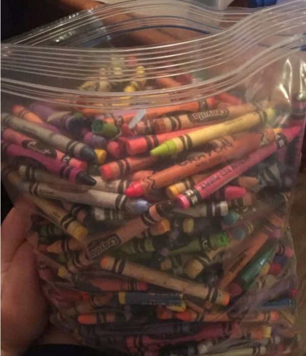 a plastic bag filled with lots of crayons