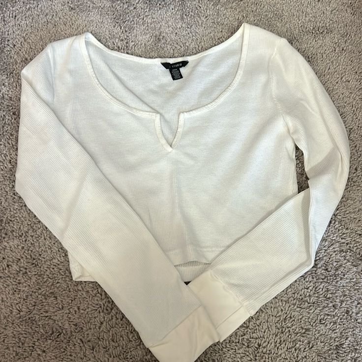 White Waffle Knit Cropped American Eagle Tee! Never Worn! Love The Material! Super Cute To Layer With A Bathing Suit Underneath! White Knit V-neck Crop Top, Casual White Ribbed Long Sleeve Top, White Waffle Knit Top For Loungewear, Long Sleeve Waffle Knit Top For Day Out, Casual Knit Crop Top For Loungewear, Casual Knit Cropped Top, Stretch Waffle Knit Long Sleeve Tops, Trendy Waffle Knit Tops For Day Out, White Ribbed Top For Layering