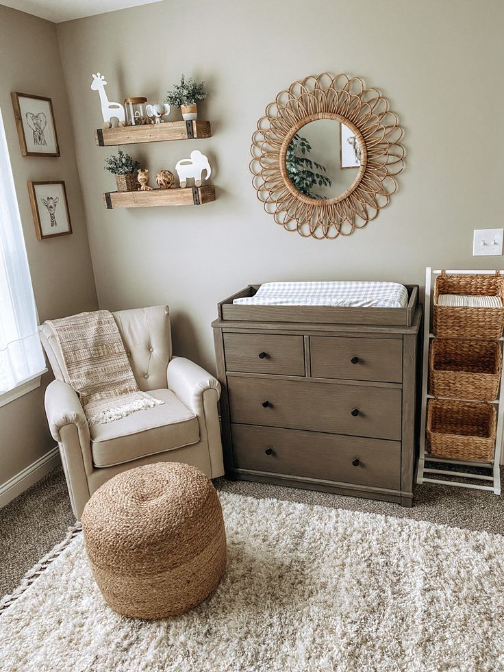 a baby's room with a crib, dresser and mirror on the wall