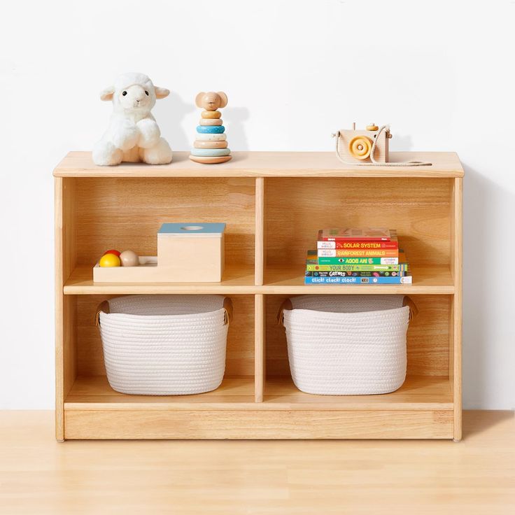 a wooden shelf with baskets and toys on it