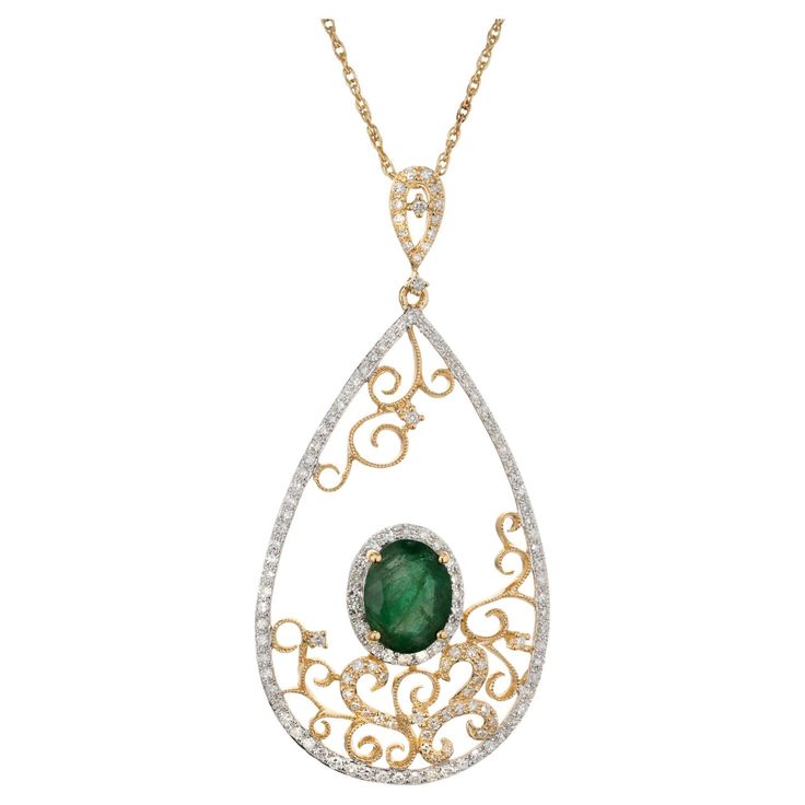 Emerald and diamond Open filigree pendant necklace. 1.35ct oval bright green center emerald set in an open work filigree design with 140 round single cut accent diamonds including a halo around the emerald. GIA certified low heat F1 clarity enhancement only. 14k yellow gold 16 inch chain. 1 oval green MI emerald, Approximate 1.35ct GIA Certificate # 5202012893 140 single cut I-J SI-I diamonds, Approximate .60cts 14k yellow gold Stamped: 14k Hallmark: EFFY 4.7 grams Top to Bottom: 48.5mm or 1 3/8 Emerald Set, Filigree Pendant Necklace, Gia Certificate, Filigree Pendant, Filigree Design, Gold Filigree, Emerald Diamond, Bright Green, Jewelry Necklace Pendant