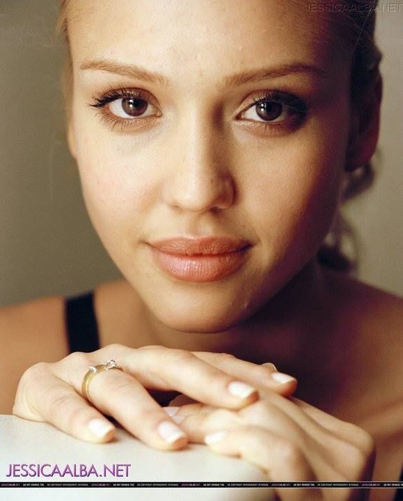 a close up of a person with a ring on her finger