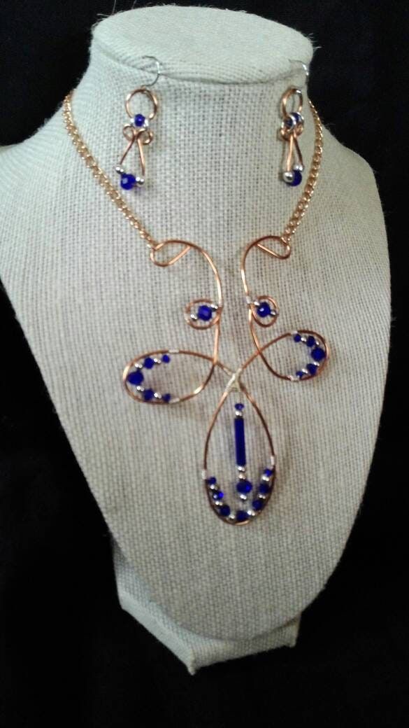 "Fleur-de-lis inspired necklace & earrings, handmade of copper wire, cobalt blue Czech crystal  beads with silver accents. Necklace focal piece is 4\" long and 3-1/4\" wide. It is adjustable to hang at choker length or below, 13-1/2\" total length. Earrings have 1-1/4\" drop. Additional coordinating earrings available under separate listings For new work, please follow me on Instagram #noladreamers" Hammered Copper Earrings, Dark Blue Earrings, Key Charm Necklace, Large Dangle Earrings, Mandala Jewelry, Cobalt Blue Earrings, September Birthstone Jewelry, Sea Glass Earrings, Inspired Necklace