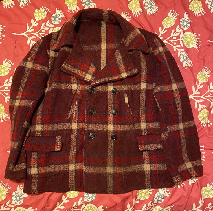 1940's/1950's vintage maroon double breasted Sportclad coat. This item is in great condition with no discernible tips, tears, stains, or flaws. Tagged size 48, but please refer to the measurements visible in the pictures.  With any vintage garment there may be small flaws, imperfections, manufacturing mistakes, etc. I do my best to find and photograph any problem areas, but I do occasionally miss things. Please be aware of this when purchasing vintage/used garments. Thank you! Fitted Vintage Burgundy Outerwear, Vintage Pea Coat With Button Closure, Vintage Brown Double-breasted Pea Coat, Fitted Burgundy Vintage Outerwear, Vintage Formal Pea Coat For Fall, Vintage Burgundy Outerwear For Fall, Vintage Brown Wool Pea Coat, Brown Vintage Wool Pea Coat, Open Road Hat