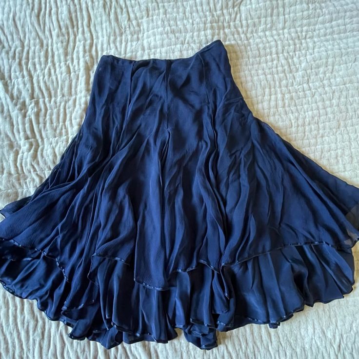 Calypso St. Barth ~ Christiane Celle Ruffled Renaissance Boho Fairy Skirt Midnight Blue Navy Vintage From 2000s 100% Silk Size 8 Nwot A Classy Skirt That Features Delicate Ruffles In Midnight Blue Silk Chiffon That Is Weightless And Absolutely Ethereal. The Color Is Sophisticated Deep Navy Blue That Can Be Worn To The Office With The Blue Calypso Button-Down I Have Listed Or A Comfy Tee For Weekend Brunch. It Fits Flat At The Waist And Then Flares Out At The Skirt. Beneath The First Ruffle Layer Blue Skirt Long, Blue Calypso, Classy Skirts, Fairy Skirt, Boho Fairy, Deep Navy Blue, Calypso St Barth, Halloween 2024, Weekend Brunch