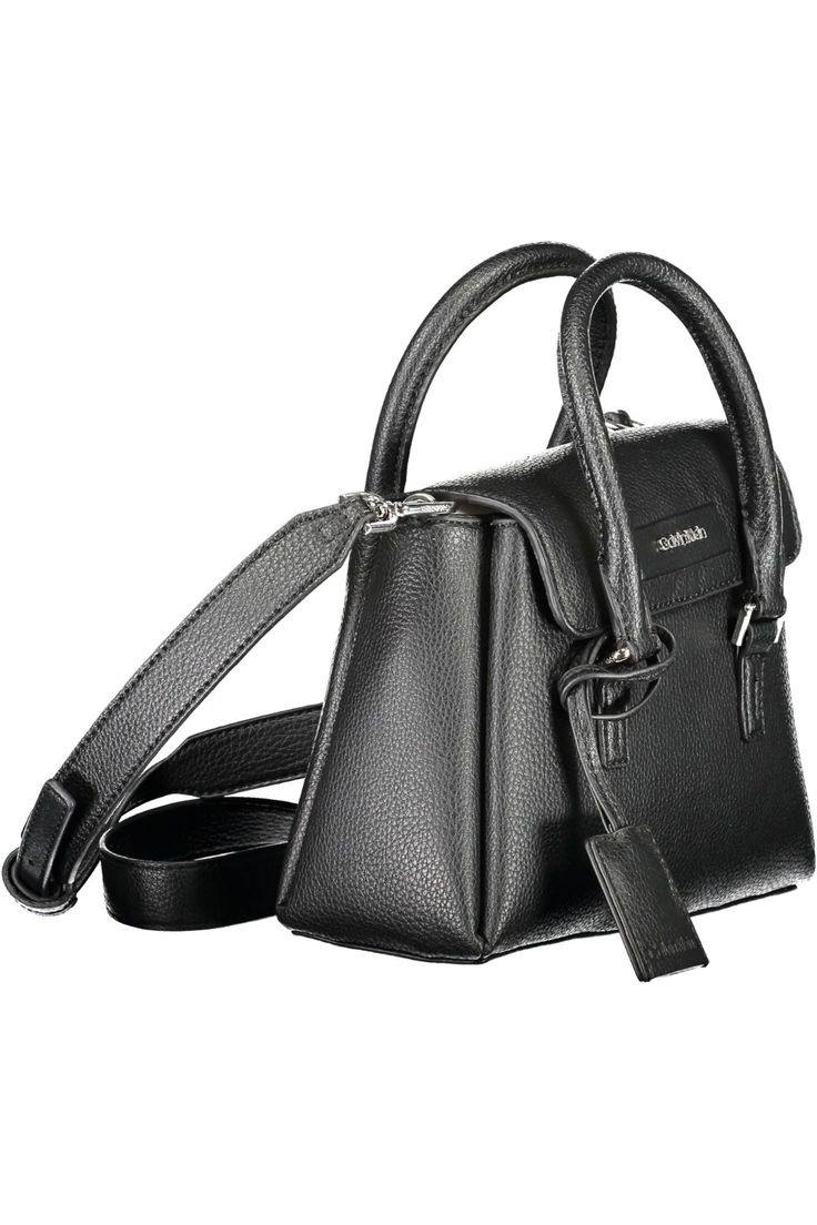 Elevate your accessory game with the Calvin Klein statement bag that effortlessly blends sustainability with chic sophistication. Crafted for the modern fashionista, this handbag showcases dual handles paired with an adjustable and removable shoulder strap for versatile styling. Its streamlined design flaunts two spacious compartments closed securely with a snap, etched with the unmistakable Calvin Klein logo. Constructed from an eco-conscious blend of materials, this piece not only speaks to yo Modern Crossbody Satchel, Sleek Travel Bag With Detachable Strap, Sleek Bag With Adjustable Strap, Sleek Rectangular Bag With Adjustable Strap, Sleek Satchel With Detachable Strap For Daily Use, Modern Shoulder Bag With Detachable Strap, Modern Box Bag With Detachable Strap, Modern Shoulder Box Bag With Detachable Strap, Modern Satchel Flap Bag With Removable Pouch