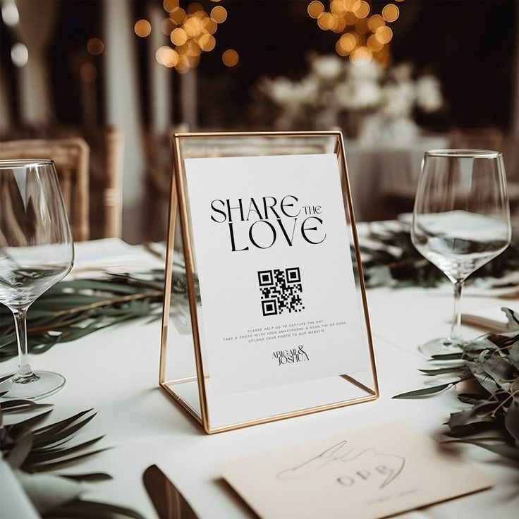 a table set with wine glasses and menus for a wedding or other special event