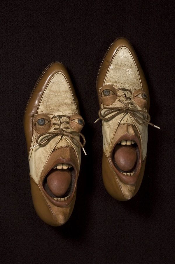 a pair of brown shoes with an open mouth