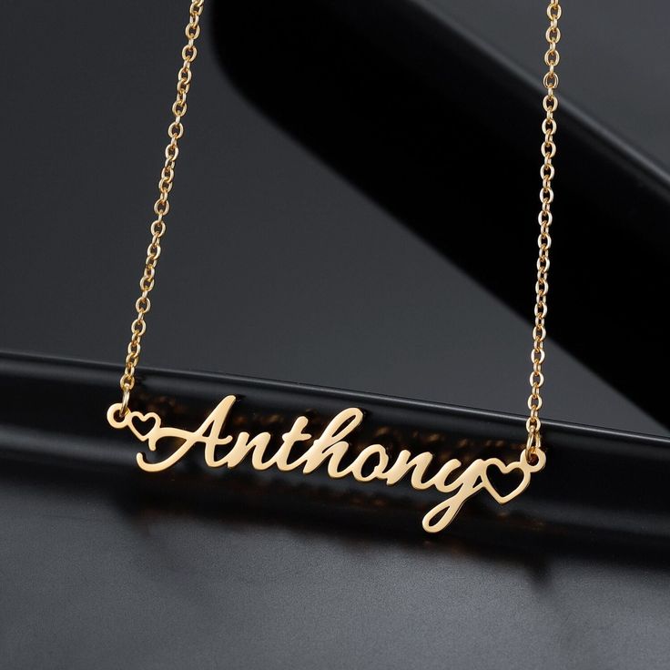 Introducing our Dainty Name Necklace featuring delicate cursive font and a mini heart charm personalized and custom-made with your desired text. Our nameplate jewelry is handcrafted with 18k Gold-plated Stainless Steel meaning it is waterproof, hypoallergenic, NON TARNISH, and everlasting.  DETAILS: -Materials: 18k Gold plated, 18k Rose Gold plated, or Stainless Steel. -Waterproof, NON TARNISH, rust-resistant, hypoallergenic and everlasting. -Chain Lengths: 14 inches, 16 inches, 18 inches, 20 in Customizable Minimalist Letter Jewelry, Minimalist Customizable Letter Jewelry, Minimalist Customized Name Necklace As Personalized Gift, Minimalist Customized Name Necklace For Personalized Gift, Customized Minimalist Name Necklace For Personalized Gift, Minimalist Customizable Name Necklace For Valentine's Day, Minimalist Personalized Name Necklace, Minimalist Letter Name Necklace, Minimalist Letter Shaped Custom Name Necklace