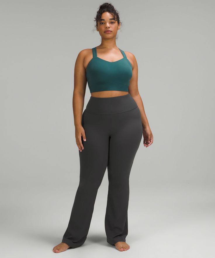 A coveted classic. These flared pants are perfect for your practice and beyond. Designed for Yoga and Casual. Hugs your body from waist to knee:Flares out from the knee to hem:32.5" inseam, intended to sit just off the ground for heights of 5'5"-5'8". Back drop-in waistband pocket holds a card, key, or cell phone. This collection's great for low-impact workouts like yoga or whenever you want to feel really, really comfortable. Womens Athletic Outfits, Flare Pant, Low Impact Workout, Flared Pants, Back Women, Athletic Outfits, Lululemon Women, Tight Leggings, Cropped Leggings