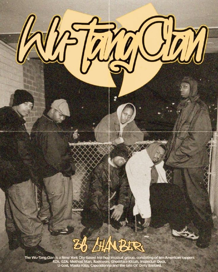 a group of young men standing next to each other in front of a chain link fence