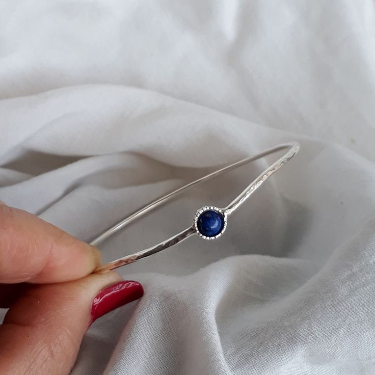 "Modern and simple Wave Hammered bangle for women. 2mm. Sterling silver wire stacking bangle is perfect in its simplicity. Gemstone bangle modern and trendy look. Summer jewelry, graduation gift. 6mm. Lapis Lazuli stone set in a decorated stone house. Layering bracelet, Everyday bracelet. Very important! to avoid mistakes, please make sure you have the right size. If you not sure then look at item photos and learn how to do it. Choose your length look at the picture to know how to take the right Adjustable Simple Bangle Jewelry, Sterling Silver Stackable Bangle For Anniversary, Sterling Silver Round Bracelet With Birthstone, Stackable Sterling Silver Bracelets, Sterling Silver Round Cuff Bracelet Gift, Sterling Silver Bangle With Gemstone, Sterling Silver Round Bracelet With Birthstone For Anniversary, Silver Birthstone Bangle Jewelry, Adjustable Bracelets With Bezel Setting As Gift