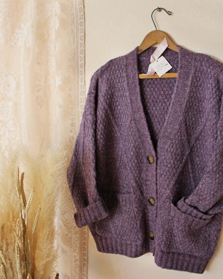 Dried winter lavender tones pair with the softest nubby textured knit. Designed with a cardigan fit, front pockets and a slouchy cozy fit.  Perfect for staying cute in chilly weather. Cozy oversized fit Color: Dusty lavender Cotton & Acrylic Blend Hand wash cold Ships from our small family store in Washington State. Due to the handmade nature of our pieces, all sales are final. Approximate Measurements:                                          SMALL  MEDIUM   LARGE X-LARGE Total Bust                           47    48      49            50 Length                                26    26       27            27 Winter Lavender, Lavender Cardigan, Lavender Cotton, Lavender Sweater, Dusty Lavender, Chunky Cardigan, Oversize Knit, Fall Sweater, Cozy Fits