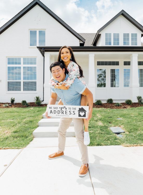 a man holding a woman on his back in front of a house with the words take me to the address