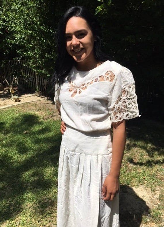 "Boho dress,off white dress,eyelet lace,summer dress Very pretty dress boho dress Says size 14 but seems like a small-medium Measurements Bust 36\" waist 30\" buttons at side waist Hips flair out to 50\" full at hips Small shoulder pads that can be removed Looks and feels like 100% cotton but is 50% cotton 50% rayon BL774+BL297 was A-r2 Boho dress,off white dress,eyelet lace,summer dress" Bohemian Short Sleeve Broderie Anglaise Dress, Bohemian Summer Lace Dress For Garden Party, Bohemian Lace Dress For Summer Garden Party, Vintage Lace Summer Dress With Short Sleeves, Vintage Lace Short Sleeve Summer Dress, Summer Vintage Lace Dress With Short Sleeves, Vintage Lace Dress With Short Sleeves For Summer, Short Sleeve Lace Vintage Summer Dress, Summer Dresses With Lace Collar