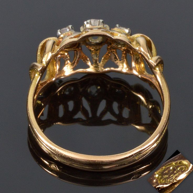 "Presented is a beautiful 19th century French 18K yellow gold ring with 3 sparkling old mine cut diamonds. Size of the ring is 6 - 6 ¼. The face of the ring is 11/16\" X 5/16\". It raised approx. 1/4\" off the finger. The central diamond is 3.6 mm which is approx. 0.26 carats. 2 side diamonds are 2.5 mm across, approx. 0.09 carats each. The ring is stamped with eagle head, which is a French hallmark for 18K gold. The ring weighs 3.1 grams. Excellent antique condition. The old jewelry box is show Victorian 14k Gold Three-stone Ring, Victorian Three Stone 14k Gold Ring, Art Nouveau Rose Cut Diamond Rings For Formal Occasions, Victorian Gold Three-stone Ring, Victorian Gold Three Stone Ring, Victorian Yellow Gold Cluster Ring With Rose Cut Diamonds, Antique Gold Diamond Ring With Rose Cut Diamonds, Victorian Yellow Gold Diamond Cluster Ring, Victorian Yellow Gold Cluster Ring With Diamond Accents