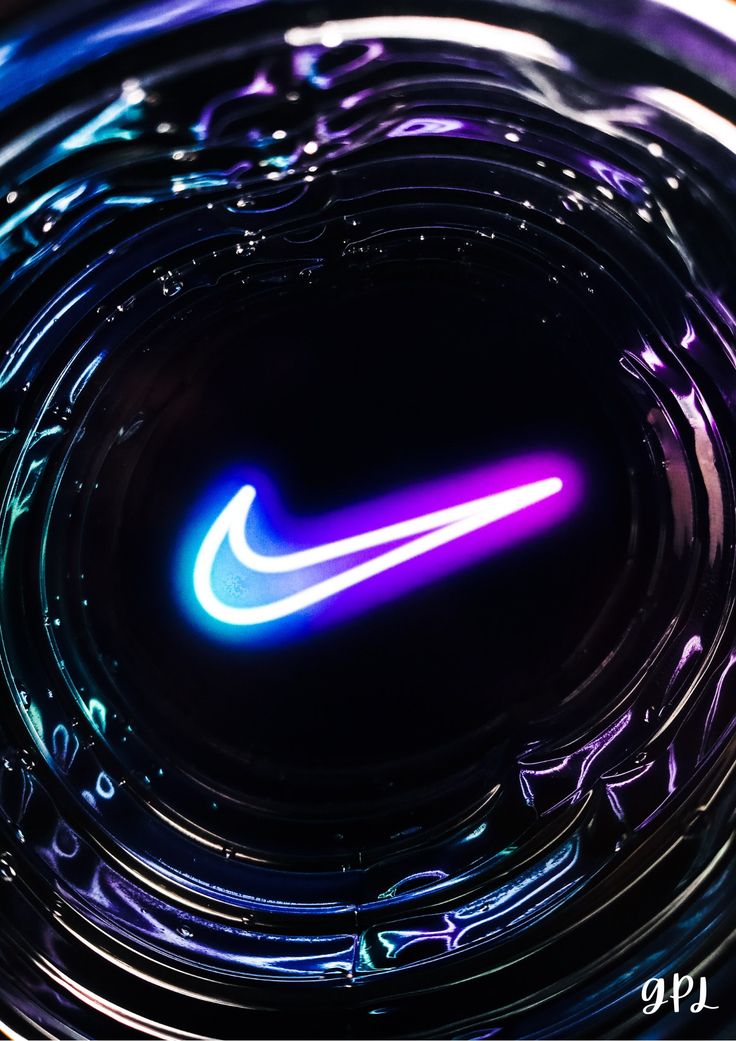 the nike logo is illuminated in purple and blue