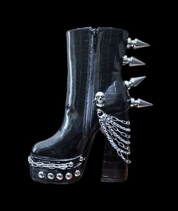 This listing is for this pair of black goth/punk style spiked 6 inches high heel women's boots .available i uk women's size 5 and 6. Made with shiny patern high quality pu leather studded with 44 mm aluminium tree spikes and skulls, accessorised with stainless steel multi-layer chains. Size: uk women's 5 and 6 Material: EVA Style: Punk / Goth The boots itself is not manufactured by me . I did the modifications with metal Embellishments and spikes of my choice . This is a made to order item retur Edgy Knee-high Heeled Boots For Streetwear, Fall Punk Knee-high Platform Boots, Punk Knee-high Platform Boots For Fall, Punk Style Wedge Boots For Fall Streetwear, Edgy Knee-high Boots For Streetwear, Punk Style Mid-calf Boots With Platform And Round Toe, Halloween Grunge Platform Boots For Cosplay, Punk Style Mid-calf Boots With Chunky Platform, Punk Style Platform Heeled Boots With Round Toe