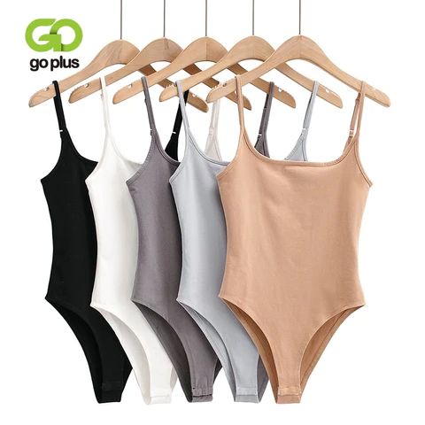 a Trendy Seamless Sleeveless Bodysuit, Seamless Sleeveless Cotton Bodysuit, Sleeveless Cotton Seamless Bodysuit, Sleeveless Seamless Cotton Bodysuit, Casual Seamless Sleeveless Bodysuit, Casual Sleeveless Seamless Bodysuit, Seamless Sleeveless Casual Bodysuit, Sleeveless Bodysuit For Summer, Solid Sleeveless Summer Bodysuit