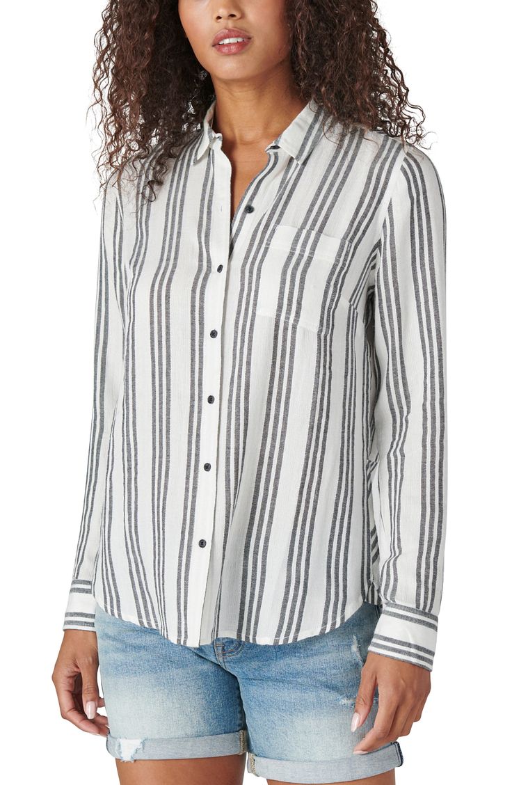 Update your everyday wardrobe with this striped button front shirt that features an eye-catching back button hem. 27" length (size S) Spread collar Long sleeves Front button closure Chest pocket All-over stripe Woven 53% cotton, 47% viscose Machine wash cold, tumble dry low Imported Model stats: 5'10", 32" bust, 25" waist, 36" hip. Model is wearing size S. Casual Shirt With Vertical Stripes And Shirttail Hem, Casual Tops With Vertical Stripes And Shirttail Hem, Casual Workwear Top With Horizontal Stripes, Classic Striped Blouse With Shirttail Hem, Casual Striped Blouse With Shirttail Hem, Relaxed Fit Vertical Stripes Button-up Blouse, Classic Striped Tops With Shirttail Hem, Casual Vertical Stripes Blouse For Fall, Casual Pinstripe Collared Blouse