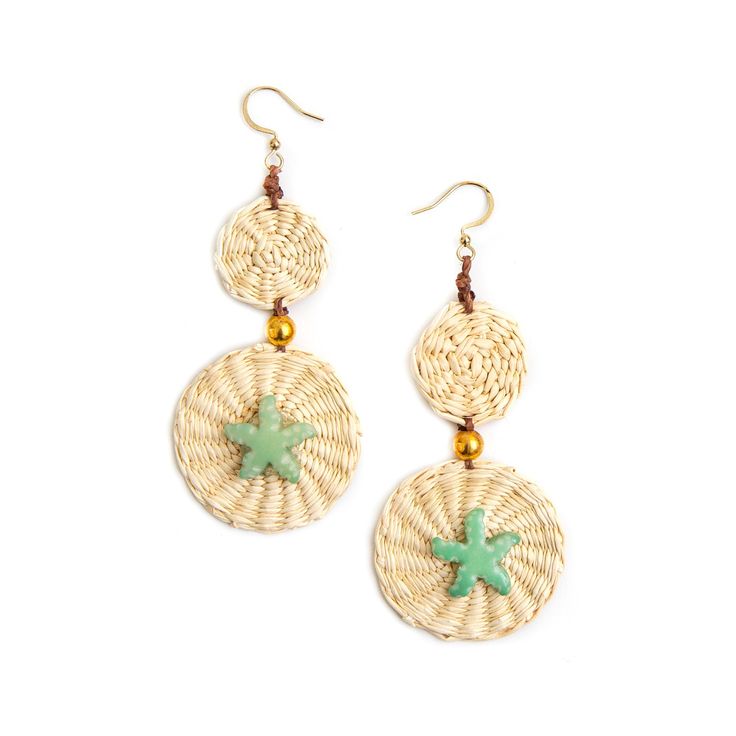 two round earrings with green crosses on the front and bottom, hanging from gold earwires