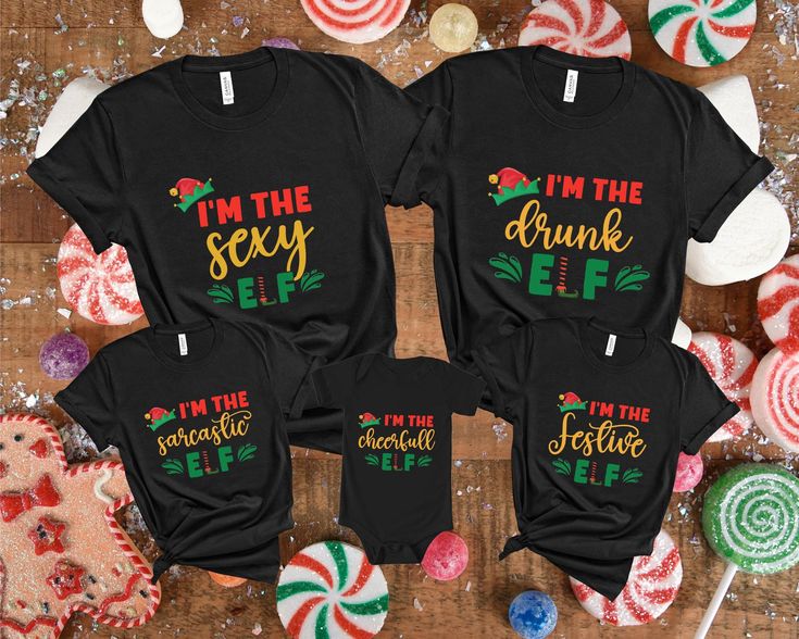 Elf Family Christmas Shirt, Personalized Elf Shirt, Christmas Matching Family Shirts, Family Christmas Pajamas, Matching Christmas Shirt   Welcome to GoldenTeeUS? We are sure that you will love our sweaters, which are different and beautiful, specially designed just for you. Now is the time to choose the most special gift for yourself and your loved ones! We wish you pleasant shopping. PRODUCT DETAILS We offer two brands for our printed shirts: Bella Canvas and Gildan SoftStyle. Both are known for their comfort and durability, but each has its unique characteristics. Please review the details below and let us know if you have a preference for either brand. Bella Canvas Unisex Sizing Fabric Weight: 4.2 oz. Materials: Solid Colors: 100% Combed and Ring-Spun Cotton Athletic Heather: 90% Combe Personalized Elf, Elf Family, Pajamas Matching, Elf Shirt, Matching Christmas Shirts, Matching Family Shirts, Christmas Matching, Family Shirts Matching, Family Christmas Pajamas