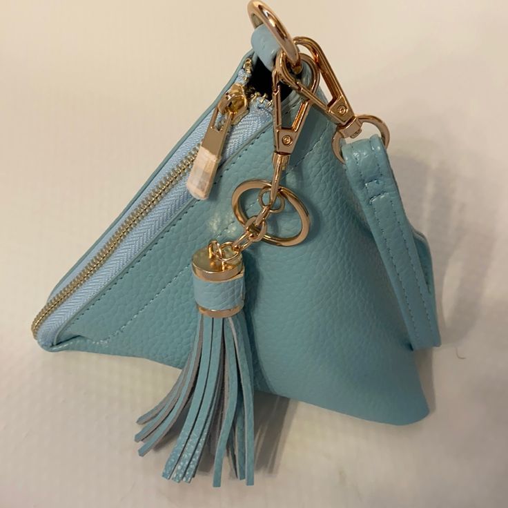 Super Cute Nwt Baby Blue Wristlet Handbag With Gold Zipper And A Tassel Detail. 7.5"X7.5"X7.5". Blue Pouch With Zipper Closure For Everyday Use, Light Blue Bags With Zipper Pouch For Everyday Use, Trendy Blue Clutch For Gift, Blue Crossbody Clutch As Gift, Blue Crossbody Clutch For Gift, Blue Mobile Phone Bag For Fashion Accessory, Blue Coin Purse With Zipper For Everyday Use, Blue Coin Purse With Zipper For Daily Use, Blue Coin Purse With Zipper Closure For Everyday Use