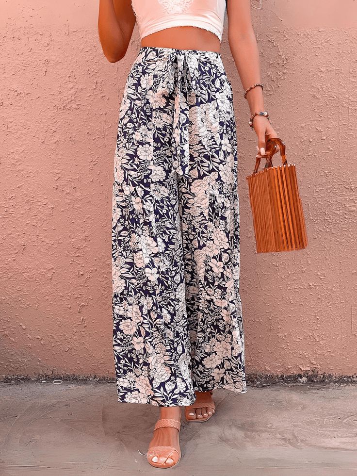 Unleash your inner fashionista with our Cancun Printed Wide Leg Belted Pant! Perfect for a day at the beach or a night out, these pants feature a fun print and a belted waist for a flattering fit. Say goodbye to boring pants and hello to style and comfort! Size Guide: Model is 5’6” tall, and has a 32.2” bust, 24.1”waist, & 35.6” hips. She is wearing a S / US 4 / AU 8. This pants is true to size. Material: 100% Rayon Feature: High rise. Belted Tie. Wide leg. Floral Printed. Back zipper closure. Relax Fit. Not lined. Care Instructions: Machine wash / Cold hand wash Trendy Boots, Leg Belt, Belted Pants, Day At The Beach, Trendy Accessories, Fun Prints, Comfortable Fashion, Floral Printed, Stylish Dresses