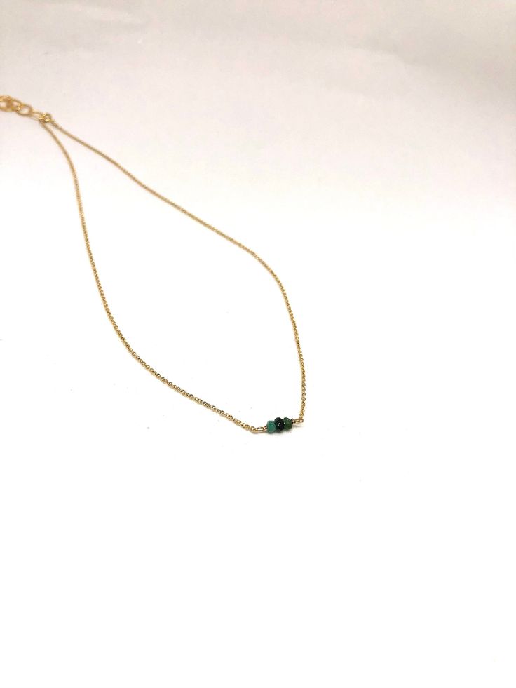 Dainty Emerald 14k gold necklace, May birthstone, handmade craft jewelry, tiny gemstone necklace, healing power gemstone, bring love & luck D E T A I L S - 14k gold filled necklace. - A tiny emerald bead wrapped with 14k gold filled wire. - An adjuster chain with large sized-links (approximately 1.5 inches) allows for easy clasping and sizing. . LENGTH - Please select from the drop down selection to choose 14 or 16 inch length. - The standard length is 16 inch length. ∙ EXTRA LOVE & ALOH Dainty Gold Emerald Necklace With Delicate Chain, 14k Gold Filled Necklace For May Birthstone, Emerald Necklace With Delicate Chain For May Birthstone, May Birthstone Emerald Necklace With Delicate Chain, Dainty 14k Gold Birthstone Necklace With Adjustable Chain, Delicate Necklace With May Birthstone, Minimalist Gold Emerald Necklace With Delicate Chain, Handmade Dainty Birthstone Necklace, Minimalist Gemstone Necklaces For May Birthstone