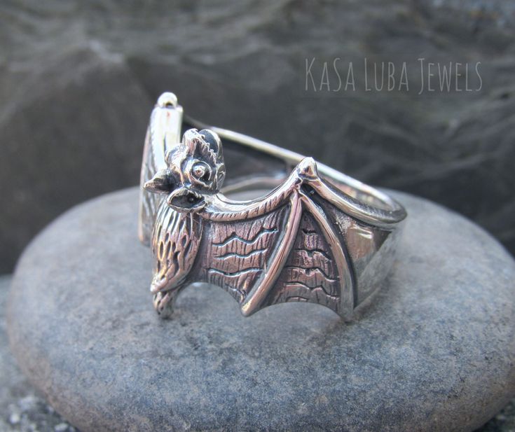 Silver Bat ring, silver sing, bold ring, halloween **Please note this ring can adjust a little too** Collection: Silver Collection Product Type: Ring Product Design: Dragon Metal: 925 Sterling Silver Hallmark: 925 Top Width: 11/32 inches Nothing but the best from my custom jewelry store. Email me if you have any questions. Gothic Silver Rings For Gifting, Gothic Silver Ring As A Gift, Silver Gothic Rings For Gifts, Gothic Silver Rings For Gifts, Gothic Sterling Silver Rings For Gift, Gothic Silver Metal Rings, Handmade Silver Gothic Rings, Silver Gothic Rings In Metal, Punk Style Silver Promise Ring Jewelry