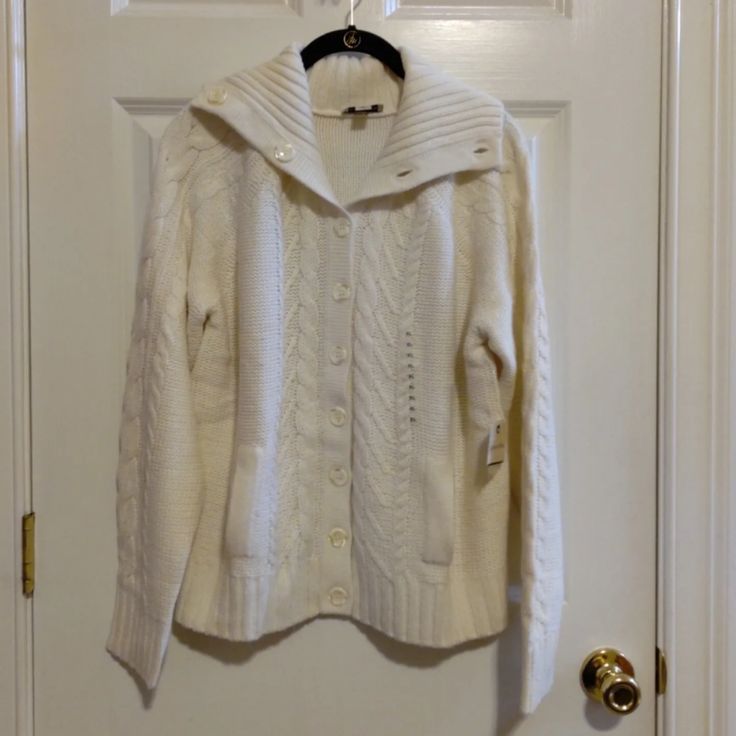 New St John's Bay Women's Ivory Cardigan Sweater Button Down Size Xl New Never Used Acrylic Long Sleeve Ivory Button Closure Machine Wash Collar Soft Knit Xl Tag Attached P To P 24" 25"L Items Sold Are Vintage/Antique/Pre Owned, Usually Showing Some Aged Wear, More Than Others. I Will List Any Flaws Or Damage That I Notice With Visual Images To Help. Please Study Photos And Note That Colours Can Vary By Screen Monitor. Item Are As Is. 2 Lb 1222 D Cream Button-up Winter Sweater, Cream Sweater With Button Closure For Winter, White Cable Knit Button-up Outerwear, Winter Cream Cardigan With Button Closure, Cream Sweater Coat With Buttons, White Winter Cardigan With Button Closure, Classic White Sweater With Buttons, White Winter Sweater With Button Closure, White Button-up Sweater For Fall