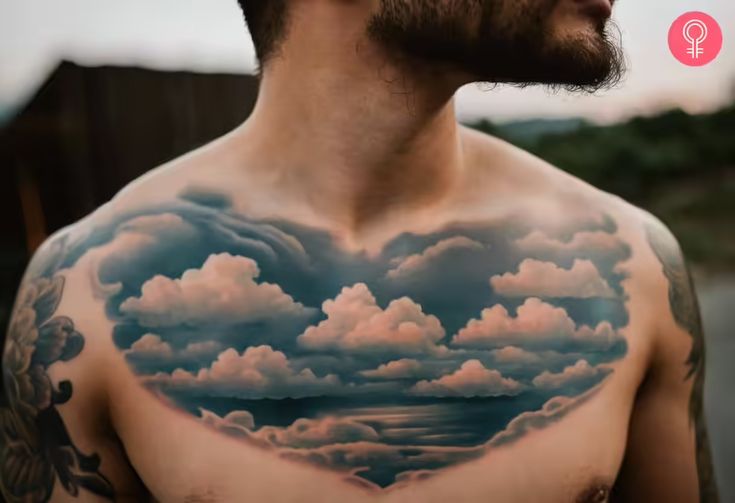 a man with a heart shaped cloud tattoo on his chest is looking into the distance