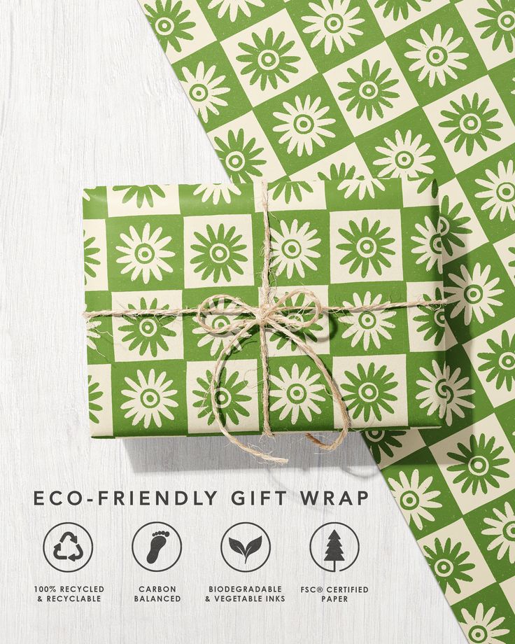 an eco - friendly gift wrap is wrapped in green and white paper