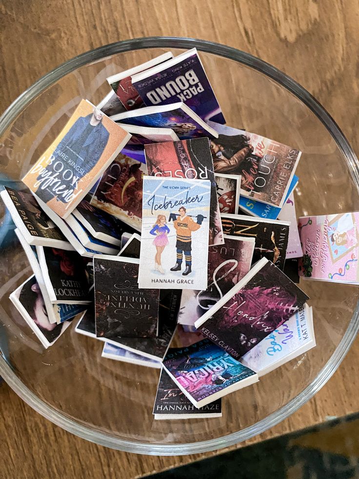 a glass bowl filled with lots of books