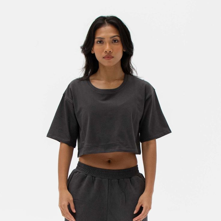 The Easy Crop Top is a must-have essential in your wardrobe. You will love our lightweight organic cotton crop top, which is perfect for your everyday basics. This piece is such a staple throw on our matching comfy sweats for a flawless street look or pair it with your favourite leggings or jeans. Ideal for in the gym and out on the streets. Made from our lightweight organic cotton. 95% organic cotton, 5% Elastane. Dyed with certified Eco-Friendly dyes. GOTS & OEKO-TEX® approved. All packaging is recycled or responsibly sourced. Cotton Athleisure Cropped T-shirt For Workout, Basic Crew Neck Crop Top With Relaxed Fit, Boxy Fit Cotton Cropped Shirt With Crew Neck, Cropped T-shirt With Relaxed Fit For Workout, Relaxed Fit Athleisure Cropped Shirt With Crew Neck, Everyday Boxy Fit Crop Top, Basic Cotton Crop Top For Workout, Boxy Cotton Crop Top With Crew Neck, Basic Relaxed Fit Cropped Shirt