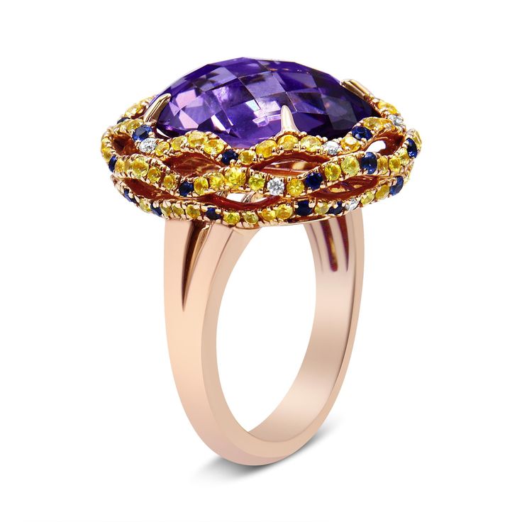 There are no words to truly describe this vividly colorful ring set in 18K Yellow and Rose Gold. The ring starts with a masterfully cut, checkboard purple amethyst set with 4 claw prongs. This magnificent purple stone measures 12mm x 11mm and gives off flashes of deep purple. The centerpiece is then finished with a yellow gold halo complete with a dazzling array of blue and yellow sapphires and white diamond accents. The entire piece sits on a rose gold band. YouÃ¢â‚¬â„¢ll never see another ring Multicolor Luxury Amethyst Ring, Luxury Purple Multi-stone Rings, Luxury Multicolor Jewelry With Center Stone, Luxury Multicolor Rings With Center Stone, Luxury Multicolor Amethyst Ring As Gift, Luxury Multicolor Amethyst Ring Gift, Luxury Multicolor Amethyst Ring For Gift, Luxury Purple Multi-stone Sapphire Ring, Luxury Multicolor Amethyst Ring With Gemstone Accents