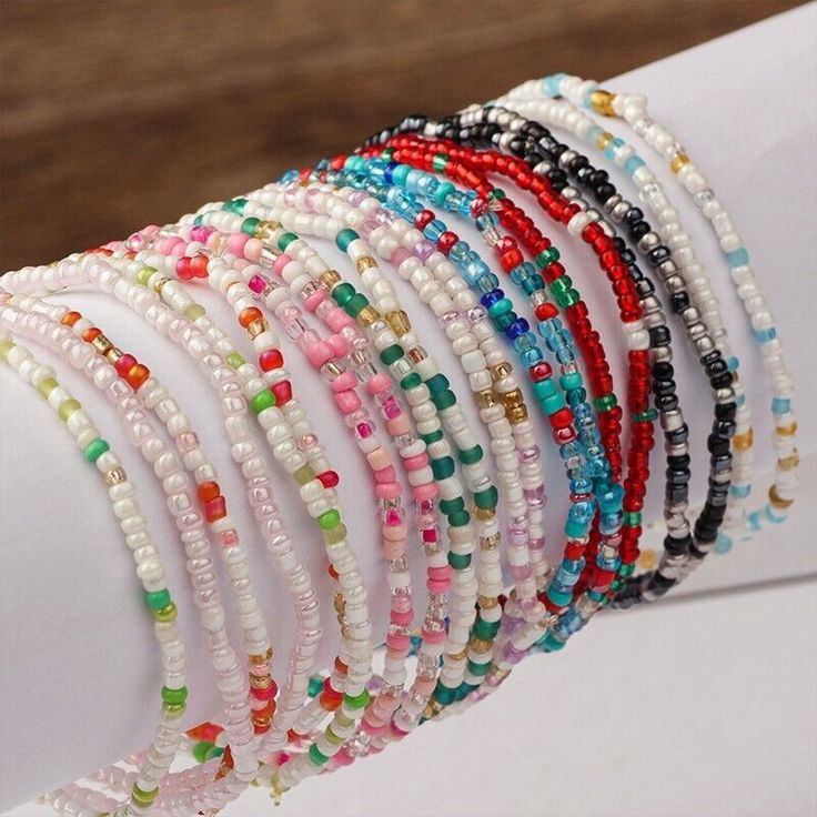 a stack of bracelets with different colored beads