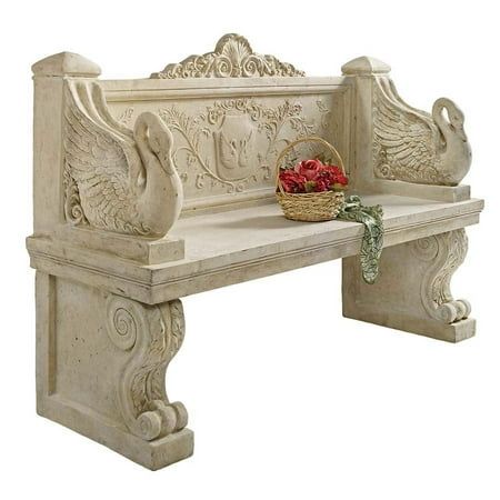 a white bench with a basket of flowers on it's back and an ornate carving work