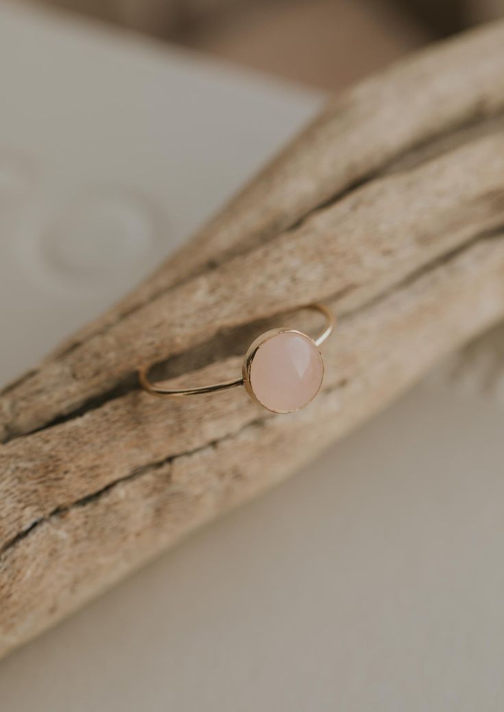 Our Rosie ring is made with a stunning Rose Quartz stone. Known as the crystal of unconditional love, it's said to boost feelings of self-love and foster loving relationships with others. It’s a crystal connected to the heart chakra which colors our life with compassion, love and beauty. 8mm round or 6x8mm round rose quartz stone. Ring band measures 1mm wide. Available in 14kt Gold Fill + Sterling Silver. Rediert pairs it with our Supermoon Ring and Teeny-Tiny Band. Kayla pairs it with two Confe Loving Relationships, Copper Uses, Love And Beauty, Everyday Wear Jewelry, Rose Quartz Stone, Midi Rings, Ring Sizer, Jewelry Cleaner, Relationships Love