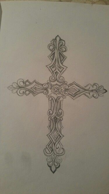 a drawing of a cross with intricate designs