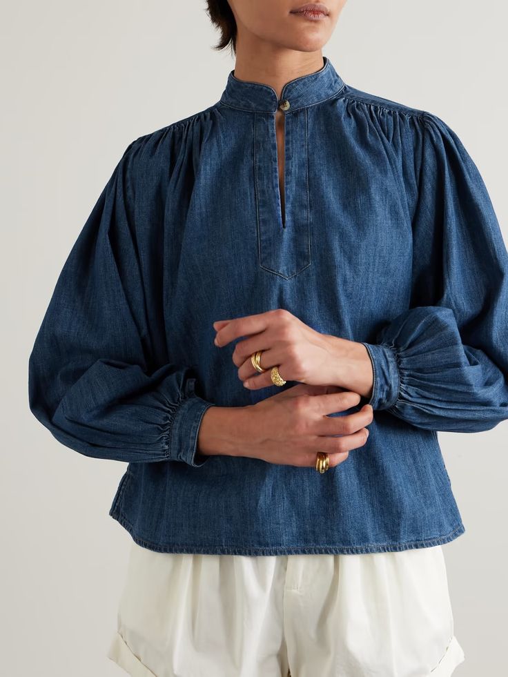 SUZIE KONDI Kaprico gathered denim blouse | NET-A-PORTER Chic Cotton Light Indigo Top, Chic Light Indigo Cotton Tops, Relaxed Fit Denim Blouse, Chic Washed Blue Cotton Blouse, Chic Denim Blue Cotton Blouse, Washed Blue Relaxed Fit Blouse, Chic Medium Wash Long Sleeve Tops, Chic Long Sleeve Medium Wash Tops, Denim Blue Cotton Blouse In Relaxed Fit