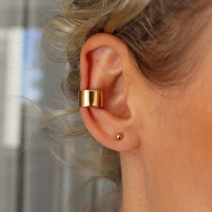 Gold Filled Ear Cuff - Personalized Earcuff - No Piercing Earring, Conch Earring,  Cartilage Earring Thick Minimalist Ear Cuff Ring Hammered Handmade ear cuff in Gold Filled 14K or Sterling Silver 925 No Piercing Earring, perfect for every day. Wide ear cuff.  The thick ear cuff is crafted in minimalist style and hammered for shine.   Made in Gold Filled 14K or Sterling Silver 925. The earring can be engraved outside/inside with initials/symbols you wish.  Features: - Handmade earring - No-pierc Classic Ear Cuff, Thick Conch Hoop, Minimalist Pierced Adjustable Ear Cuff, Adjustable Metal Minimalist Cartilage Earrings, Minimalist Adjustable Pierced Ear Cuff, Adjustable Rose Gold Ear Cuff, Hypoallergenic Metal Minimalist Ear Cuff, Minimalist Metal Hypoallergenic Ear Cuff, Minimalist Hypoallergenic Metal Ear Cuff