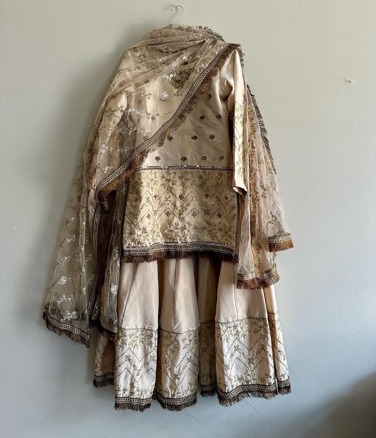 This 3 piece set is made from Raw Silk with handwork all over. The set comes in a shirt, sharara, and dupatta. Can be customized.  We also do custom orders, reach out to us to learn more. Embroidered Raw Silk Palazzo Set With Traditional Drape, Embroidered Raw Silk Palazzo Set, Raw Silk Sharara With Gota Work And Straight Kurta, Straight Kurta Sharara With Gota Work In Raw Silk, Traditional Chanderi Sets With Gota Work, Anarkali Sharara With Dupatta For Festive Occasions, Anarkali Sharara With Dabka Work And Traditional Drape, Anarkali Sharara With Dabka Work, Designer Chanderi Sharara With Resham Embroidery