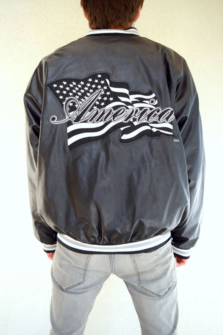 "Vintage AMERICA bomber jacket, 90s outwear, 80s jacket, hip hop, black windbreaker, men jacket, old school, oversized women jacket, L/XL Comfy and good looking vintage AMERICA bomber jacket with two side and one inside pocket. Old school and hip-hop vibes in the air, right? Size: given XL, seems like men (L) and women (XL) Measurements: Length: 70 cm/ 28\" Shoulder to shoulder: 54 cm/ 21\" Sleeve: 66 cm/ 26\" Chest: 130 cm/ 51\" Condition: excellent Brand: Steve and Barrys Fabric: polyvinyl, wo Retro Fall Track Jacket For Streetwear, Oversized Winter Varsity Jacket For Streetwear, Urban Oversized Varsity Jacket For Streetwear, Oversized Hooded Urban Varsity Jacket, Retro Long Sleeve Varsity Jacket For Streetwear, Black Windbreaker For Streetwear In Fall, Black Windbreaker For Fall Streetwear, Black Fall Windbreaker For Streetwear, Winter Hip Hop Varsity Jacket For Streetwear