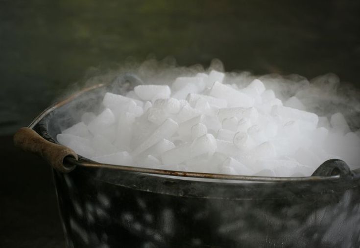 a bucket filled with sugar sitting on top of a table