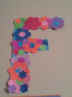 the letter f is made out of paper flowers